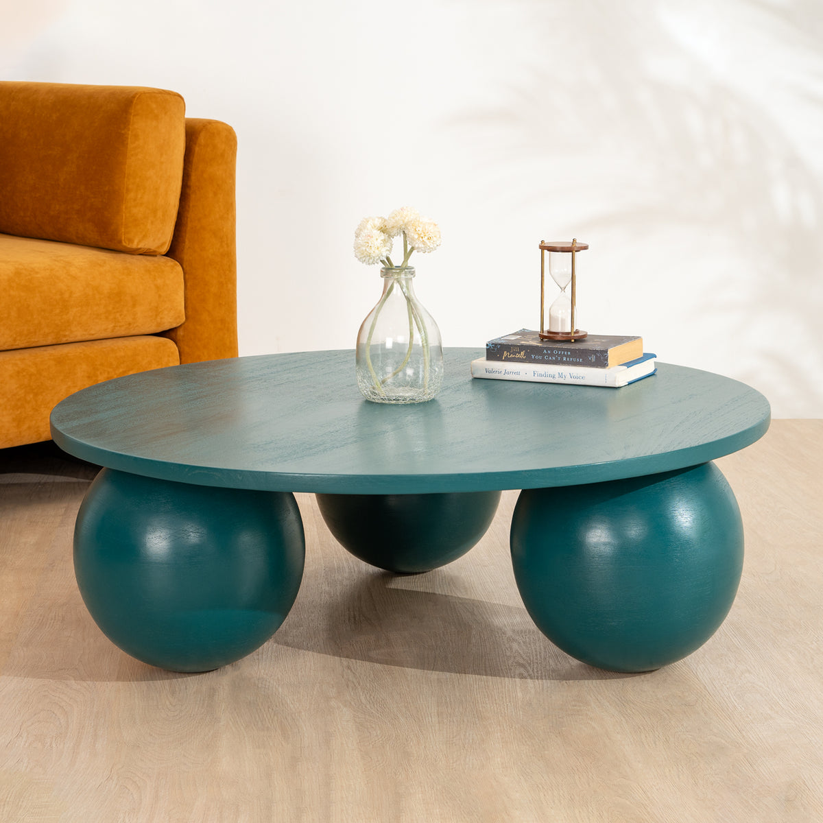 Ala Coffee Table in green stained mango wood, a modern round center table design ideal for living room decor and stylish coffee table designs.