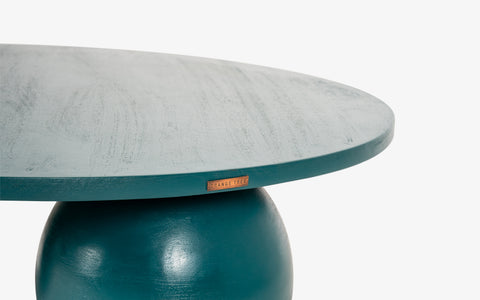 Ala Coffee Table in green stained mango wood, a modern round center table design ideal for living room decor and stylish coffee table designs.