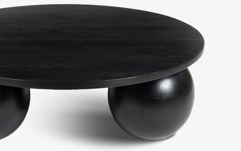 Modern Ala Noir Coffee Table with Black Mango Wood and Spherical Bases.