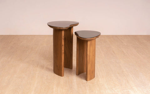 Brio Side Table Set with walnut and stainless steel finish, featuring organic bean-inspired tops and gently curved wooden legs. A modern luxury side table.