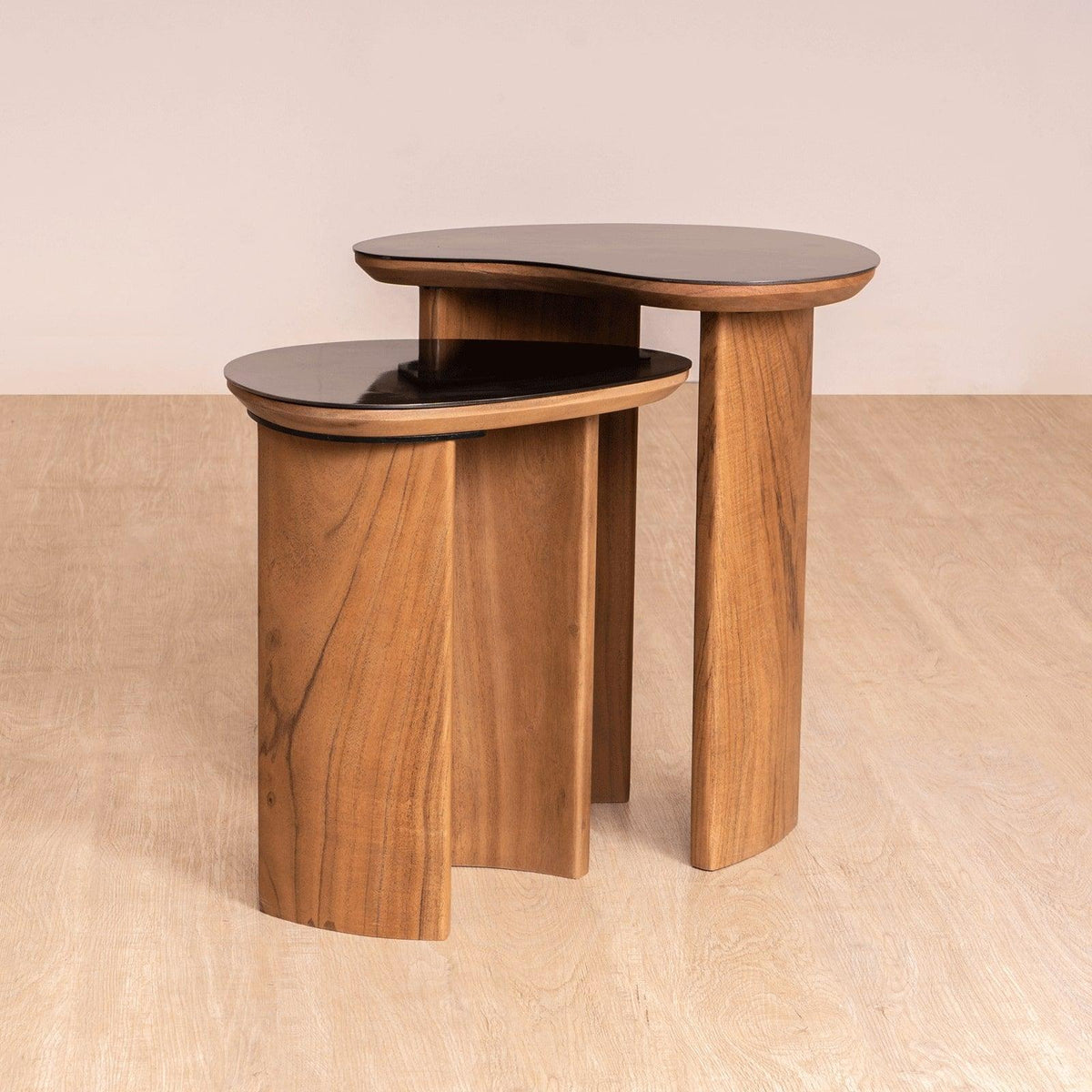 Brio Side Table Set with walnut and stainless steel finish, featuring organic bean-inspired tops and gently curved wooden legs. A modern luxury side table.