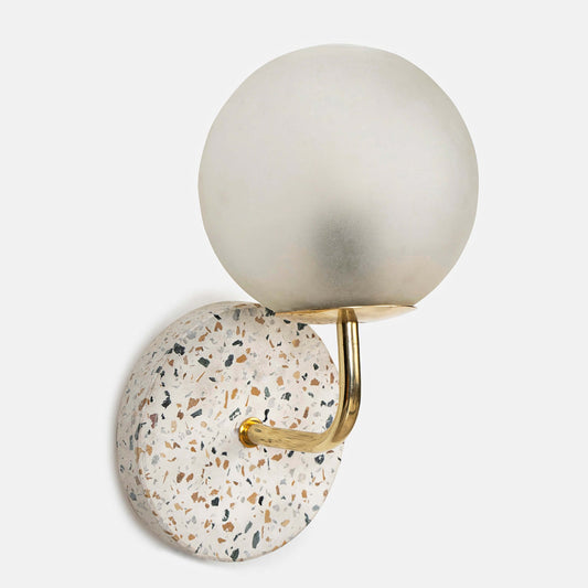 Eros White Wall Lamp with Terrazzo base, Gold-finished Mild Steel, and Frosted Glass shade.  This lamp is available online in India.