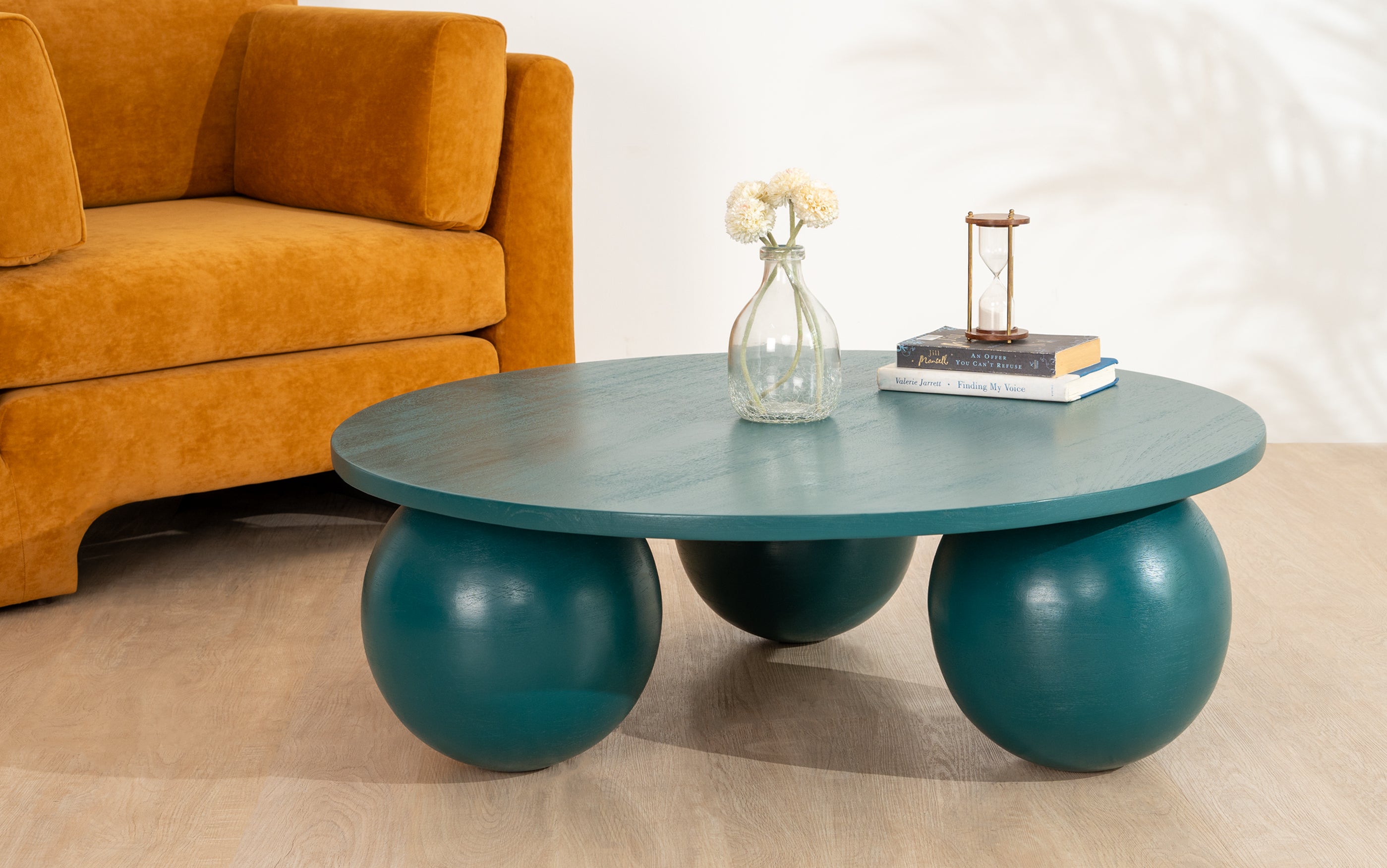 Ala Coffee Table in green stained mango wood, a modern round center table design ideal for living room decor and stylish coffee table designs.