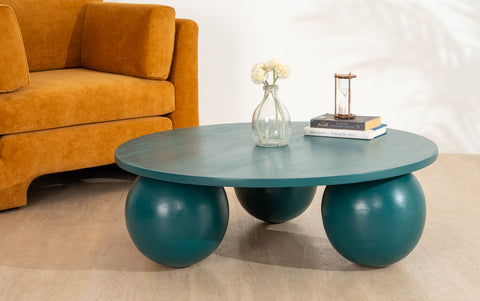 Ala Coffee Table in green stained mango wood, a modern round center table design ideal for living room decor and stylish coffee table designs.