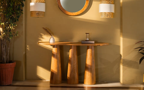 Hump console table made from oak wood with light brown cerused finish, featuring three sculpted legs. Ideal for living rooms or as a TV console.