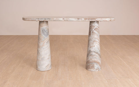 Hump Console Table made from Toronto Marble with a natural finish, featuring a pill-shaped top and tapering conical legs. Luxury marble top console table.