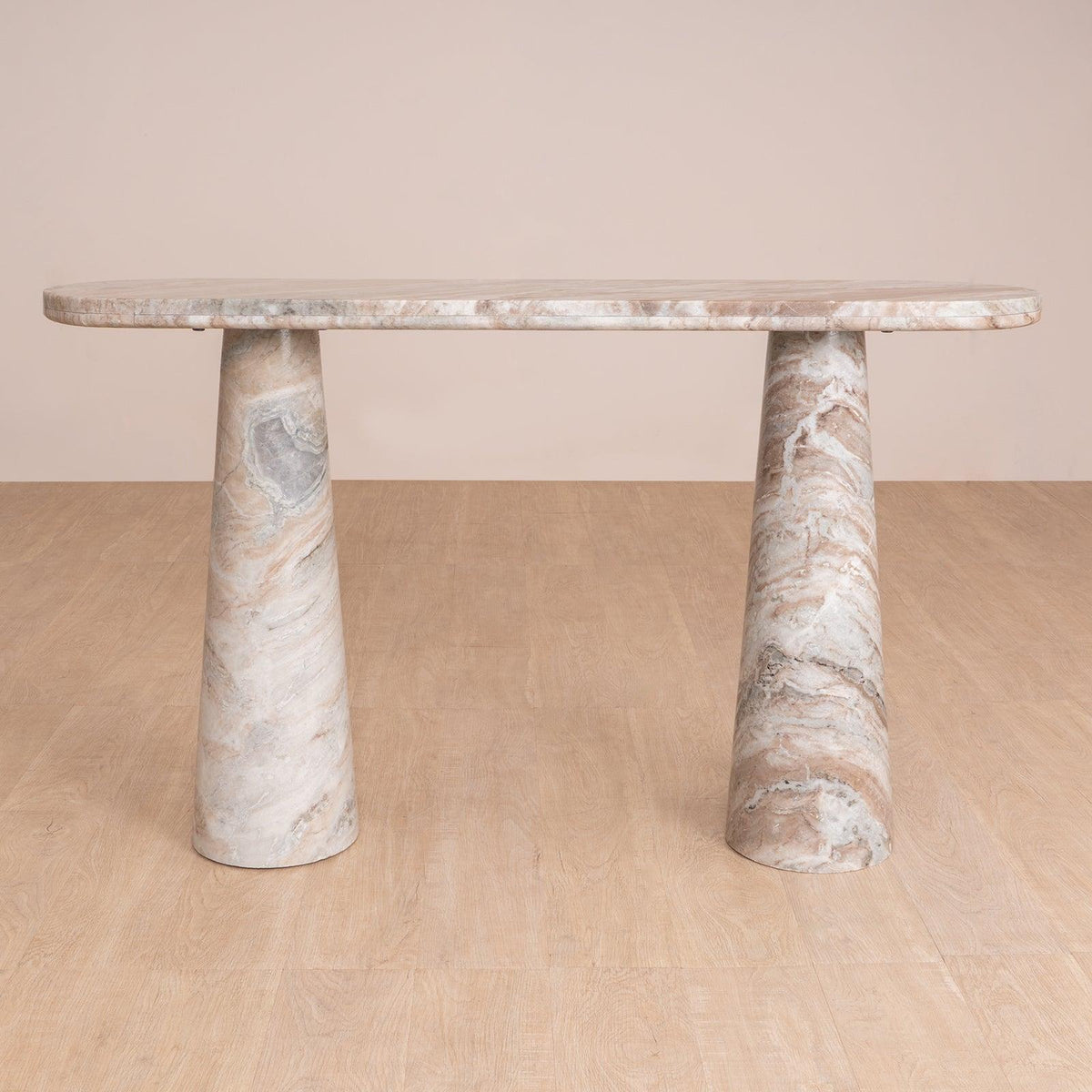 Hump Console Table made from Toronto Marble with a natural finish, featuring a pill-shaped top and tapering conical legs. Luxury marble top console table.