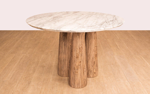 Hump Round Dining Table with Carrara Marble Top and Oak Wood Legs in light brown cerused finish. Luxury marble top dining table for elegant dining rooms.