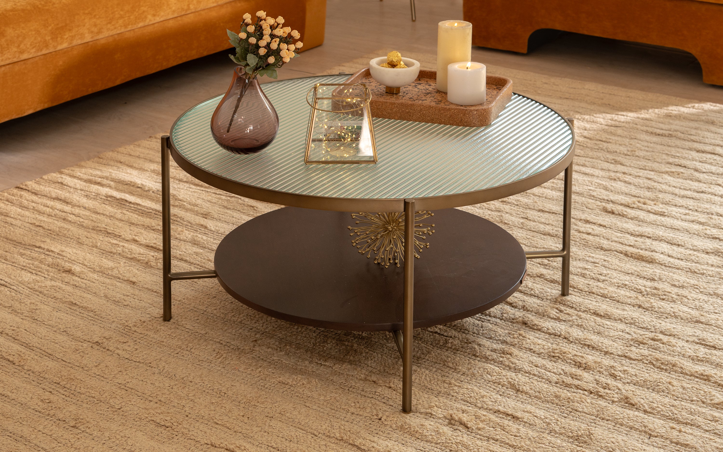 Mira Coffee Table with glass top, walnut-finished wood, and brass legs, ideal as a modern center table or tea table for living room decor.