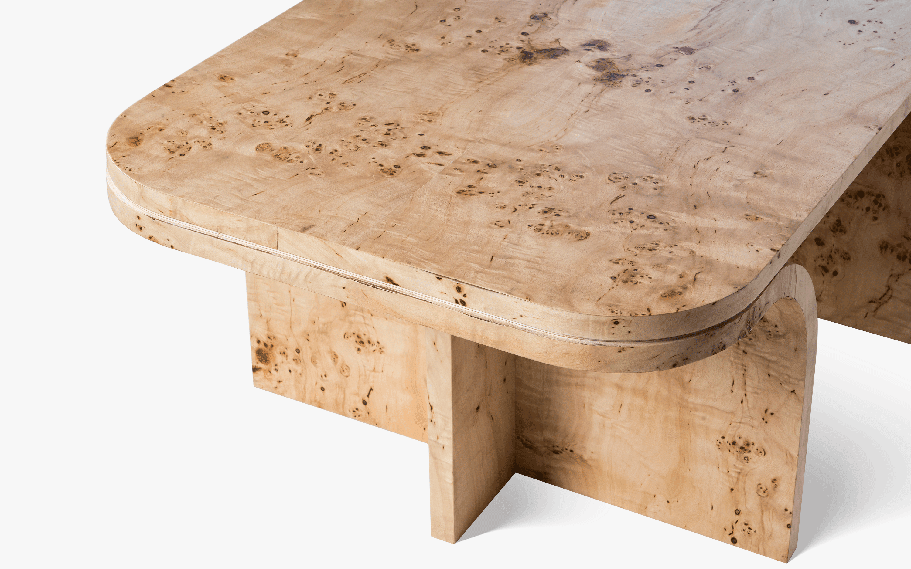 Nouve Coffee Table with Burl Veneer finish, featuring architectural curves and luxe surfaces. A modern and opulent wooden coffee table for living rooms.